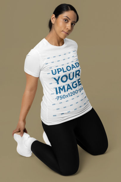 Mockup of a Yoga Instructor Wearing a Bella Canvas T-Shirt in a Studio