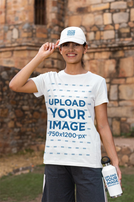 Mockup of a Happy Woman Wearing a T-Shirt and a Dad Hat while Holding a Travel Mug