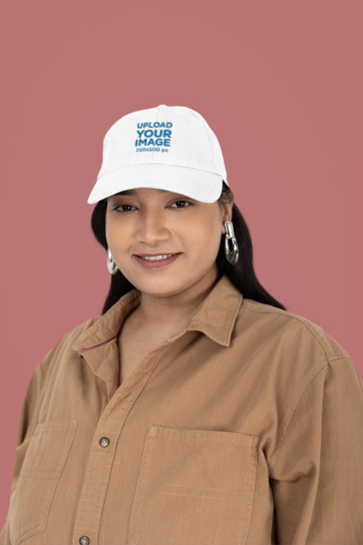 Mockup of a Happy Woman Wearing a Dad Hat in the Studio
