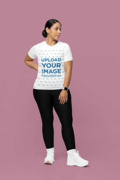Mockup Featuring a Woman Wearing a Crewneck Bella Canvas T-Shirt in a Studio