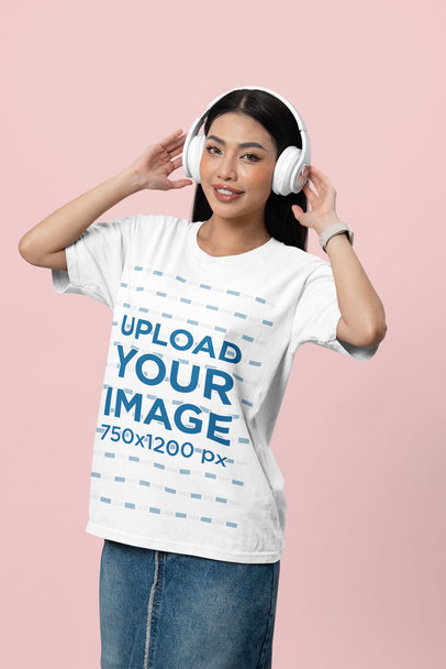 Mockup of a Happy Woman Wearing a Crewneck T-Shirt and Headphones