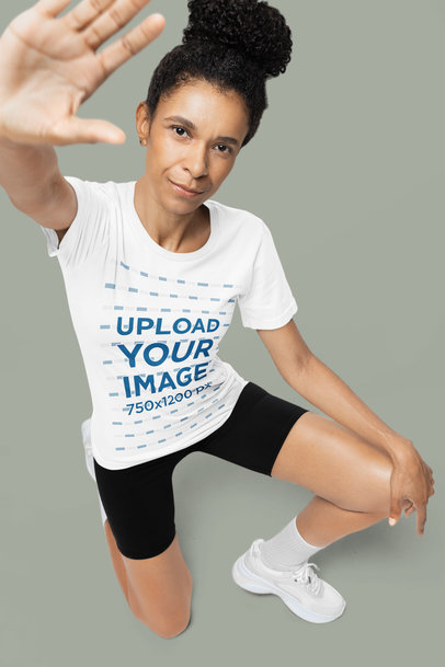 Bella Canvas Round-Neck Tee Mockup of a Woman in a Half Kneeling Position m40143