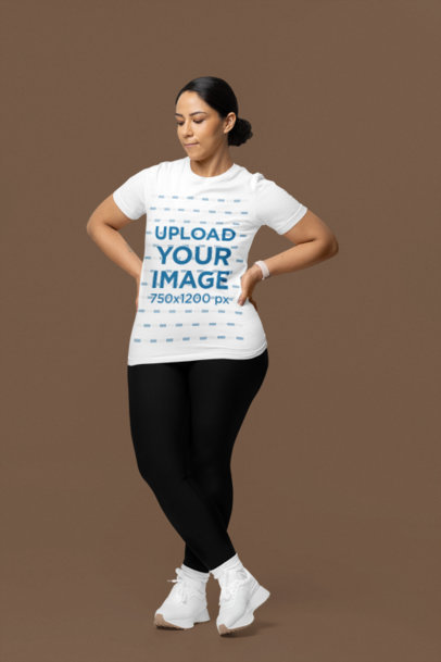 Bella Canvas T-Shirt Mockup of a Serious Woman With Activewear Clothes in a Studio