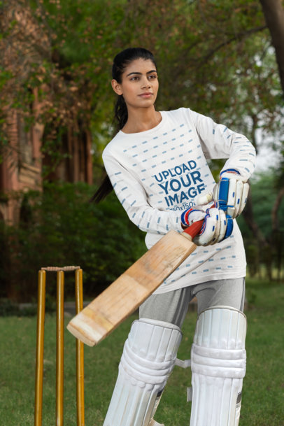 Bella Canvas Long-Sleeve Tee Mockup of a Sporty Woman Using a Cricket Stick