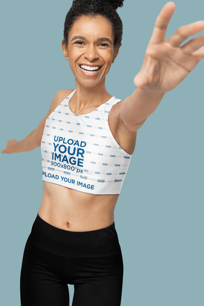 Fully Lined Sports Bra Mockup Featuring a Joyful Woman Stretching Her Arm