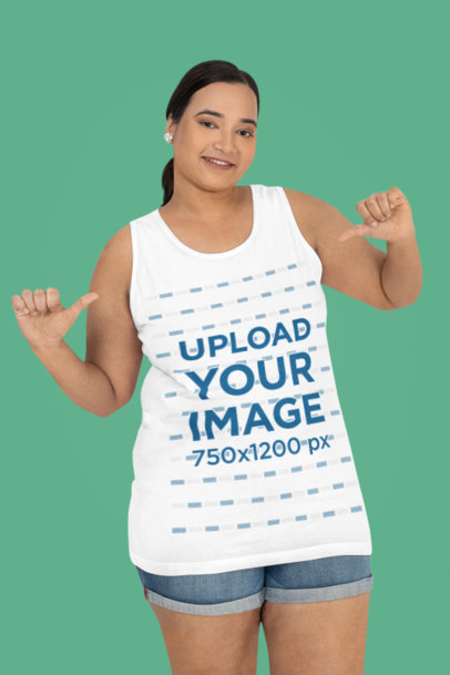 Mockup of a Happy Woman Pointing at Her Plus Size Tank Top in a Studio