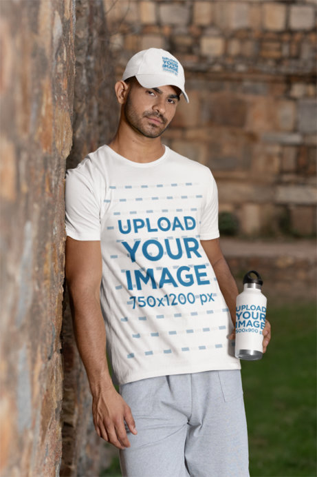 Round-Neck Tee Mockup of a Man With a Dad Hat Holding a Travel Mug