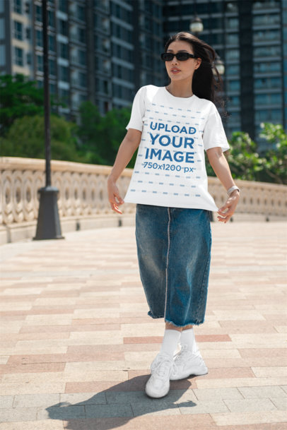 Bella Canvas Tee Mockup of a Woman Posing in the Street With a Serious Look