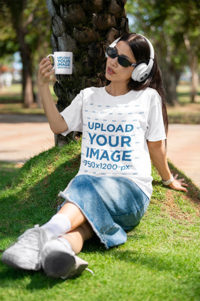 Bella Canvas Tee Mockup of a Woman Using Headphones and Holding a Coffee Mug m40213