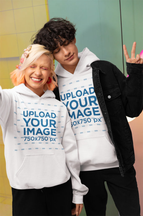 New Pop Wave-Style Mockup of Two Friends Taking a Selfie in Matching Hoodies