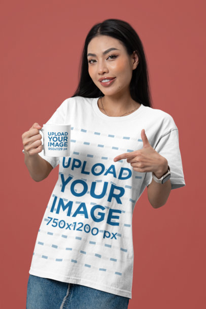 Bella Canvas T-Shirt Mockup of a Smiling Woman Holding a Sublimated Mug in a Studio
