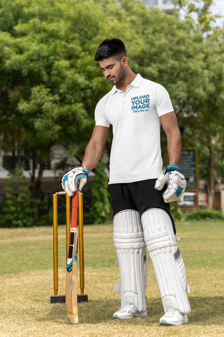 Polo Shirt Mockup Featuring a Man Wearing Cricket Gear on a Field
