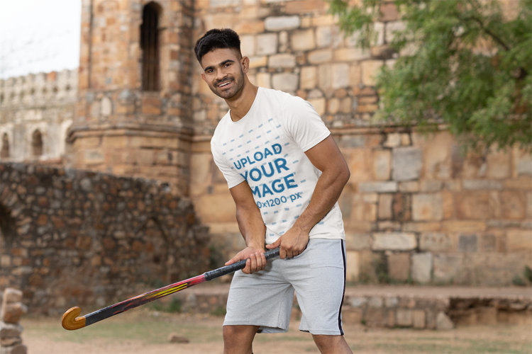Rounded-Neck T-Shirt Mockup Featuring a Man Playing Cricket