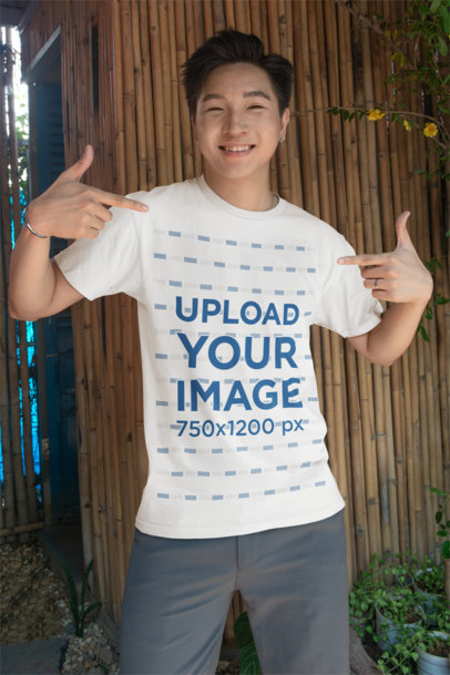 Bella Canvas Mockup Featuring a Smiling Man Pointing at His Round-Neck T-Shirt