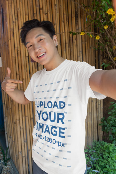 Selfie Mockup Featuring a Smiling Man Pointing at His Crewneck T-Shirt