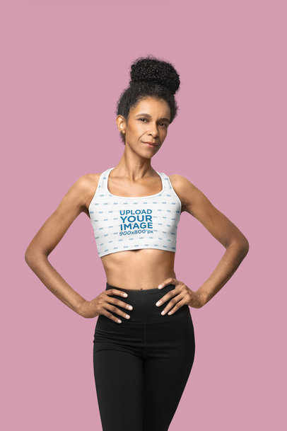 Sports Bra Mockup of a Fitness Woman With Her Hands on Her Waist Standing in a Studio m40158