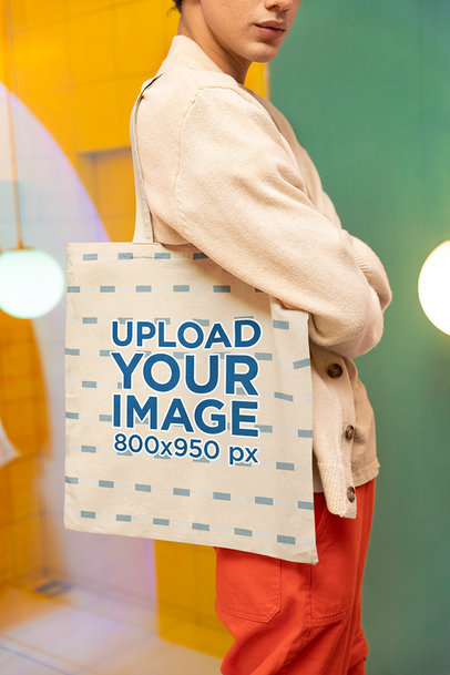 New Pop Wave-Inspired Mockup of a Man Carrying a Tote Bag on His Shoulder m38780