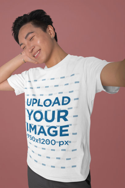 Selfie Mockup Featuring a Joyful Man Wearing a Rounded-Neck T-Shirt
