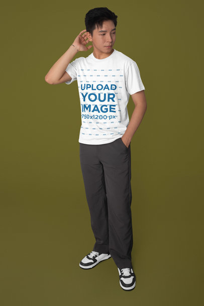Mockup of a Serious Man Wearing a Round-Neck Bella Canvas T-Shirt in a Studio