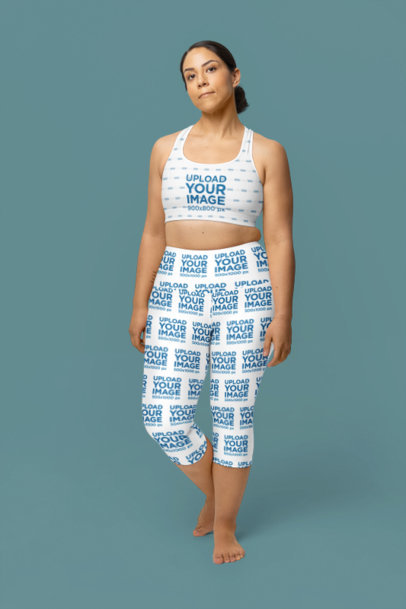Wellness Mockup of a Woman Wearing Yoga Capri Leggings and a Sublimated Sports Bra m40167