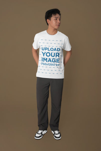 Bella Canvas Tee Mockup Featuring a Man in a Studio With His Hands on His Back