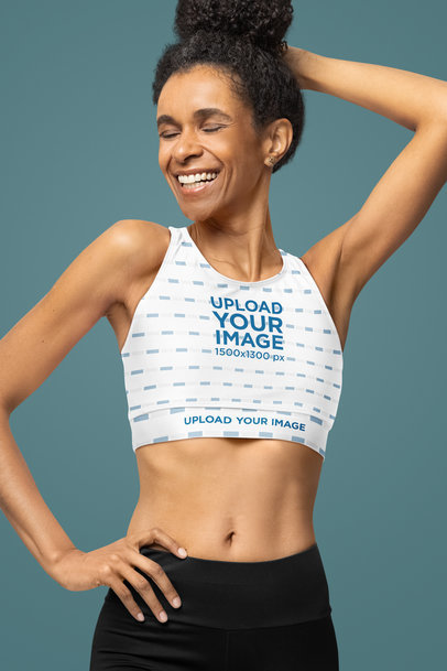 Fully Lined Sports Bra Mockup Featuring a Joyful Woman Posing in a Studio With a Wellness Style