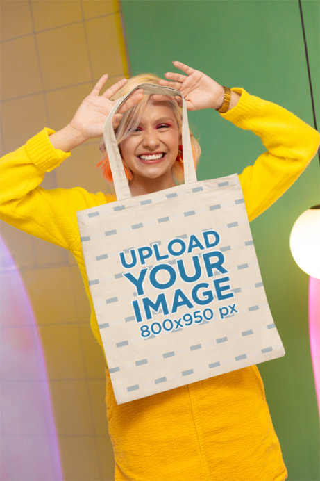 Tote Bag Mockup of a Joyful Woman in a New Pop Wave-Inspired Setting