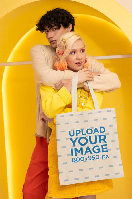 Mockup of a Man Hugging a Smiling Woman With a Tote Bag in a New Pop Wave Setting
