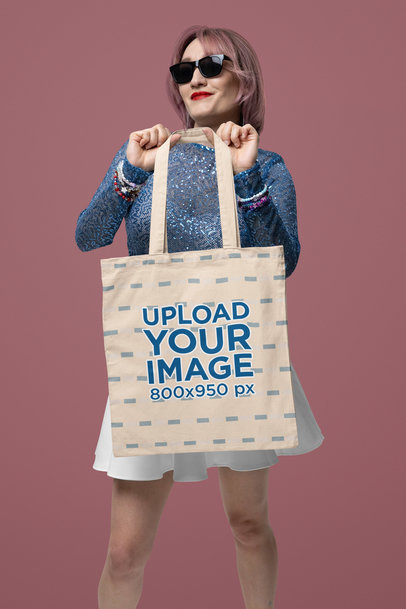 Tote Bag Mockup Featuring a Smiling Woman With a Swift Fandom-Inspired Look