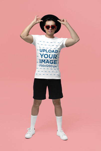 Swift Fandom-Inspired Mockup of a Man Wearing a Bella Canvas Tee and Heart-Shaped Sunglasses
