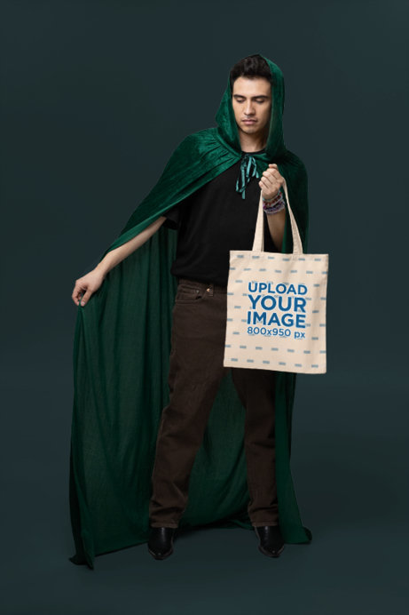 Tote Bag Mockup Featuring a Serious Man Wearing a Swift Fandom-Inspired Costume