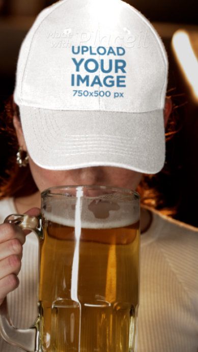 Video of a Woman Wearing a Dad Hat and Drinking Beer in a Sports Bar