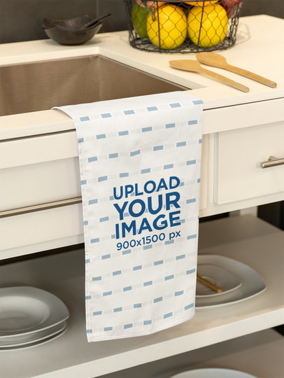 Mockup of a Sublimated Kitchen Towel Hanging From the Sink m40738