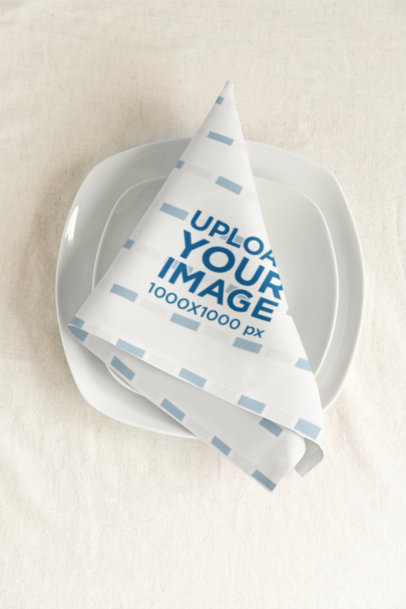 Mockup of a Folded Cloth Napkin Placed Over a Plate m40754