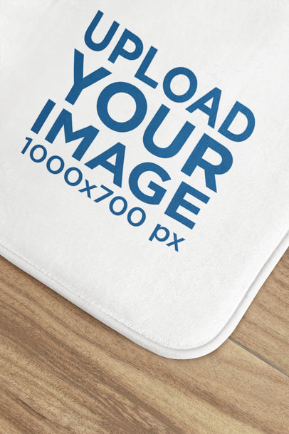 Sublimated Mockup Featuring a Bath Mat Lying on a Wooden Floor m40718