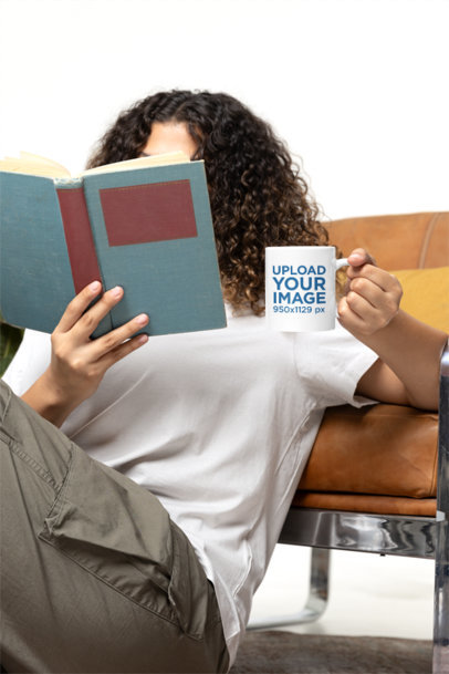 Mockup of a Curly-Haired Woman Holding a Coffee Mug While Reading m40265