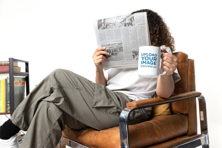 Coffee Mug Mockup of a Woman Covering Her Face With a Newspaper