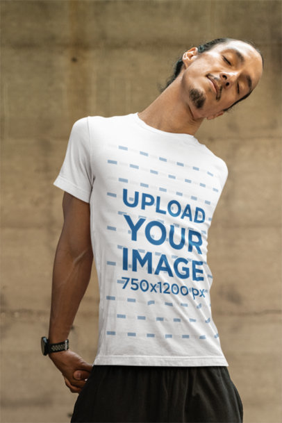 Bella Canvas Round-Neck T-Shirt Mockup of a Relaxed Man Stretching in a Yoga Class