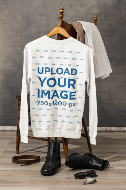 Gildan Mockup of a Back-View Sweatshirt Hanging From a Vintage Chair m39774