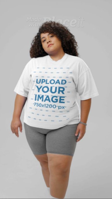 Video of a Serious Curly-Haired Woman Wearing an Oversized Tee in a Studio