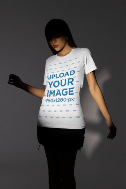 Mockup Featuring a Woman with a Shadowed Face Wearing a Bella Canvas Tee