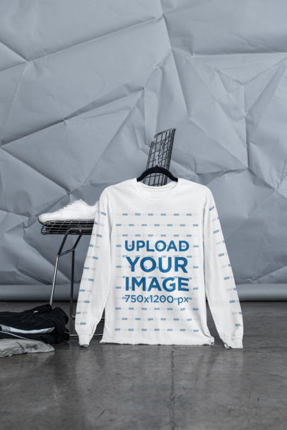 Mockup of a Bella Canvas Long-Sleeve Tee Placed on a Hanger With a Streetwear Outfit m39760