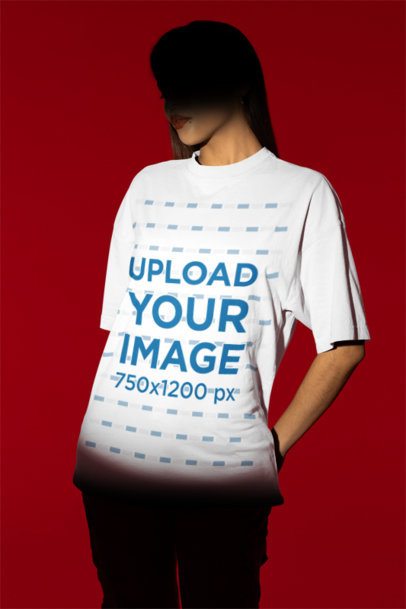 Mockup Featuring a Woman Wearing an Oversized T-Shirt in a Studio