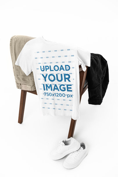 Mockup of a Round-Neck Bella Canvas T-Shirt Placed on a Chair With a Casual Outfit m39750