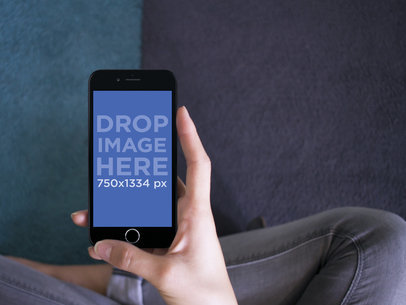 Mockup Template of a Girl Sitting Cross Legged and Using her iPhone