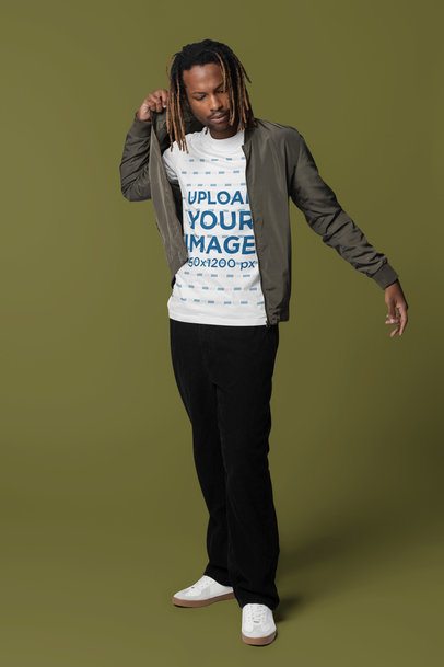 Mockup of a Man Wearing a Bella Canvas T-Shirt Under a Bomber Jacket m40843