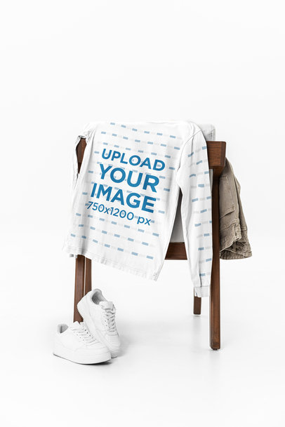 Mockup of a Bella Canvas Long-Sleeve Tee Lying on a Chair m39759
