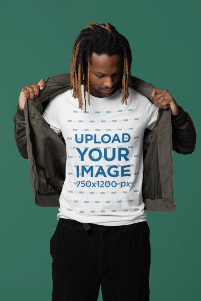 Mockup of a Man in a Studio Wearing a Round-Neck Bella Canvas Tee Under a Jacket