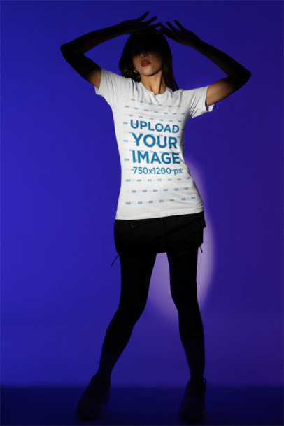 Mockup Featuring a Woman Wearing a Bella Canvas T-Shirt in a Studio