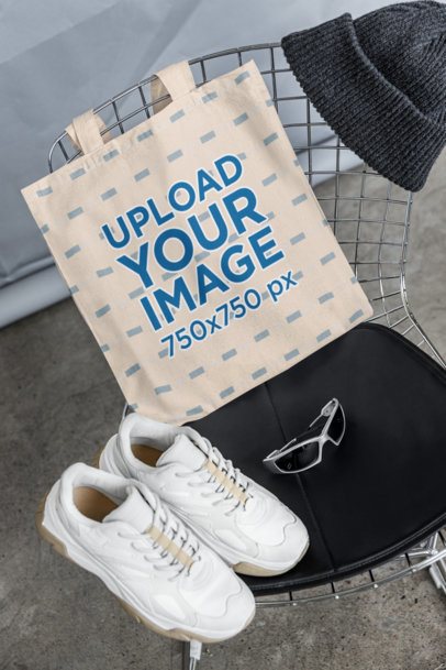 Mockup of a Tote Bag Placed on a Chair With a Pair of Sneakers m39781